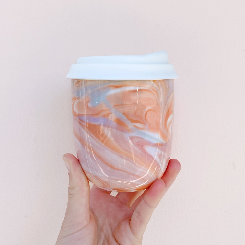 https://ohjoy.com/wp-content/uploads/2021/12/Ceramic-travel-mug-handmade-terracotta-marble-%E2%80%94-Rex-Design.png